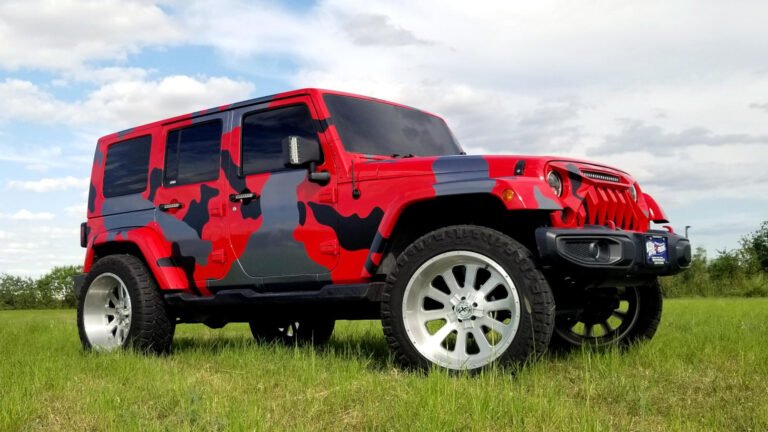 Red Jeep with camo vinyl wrap