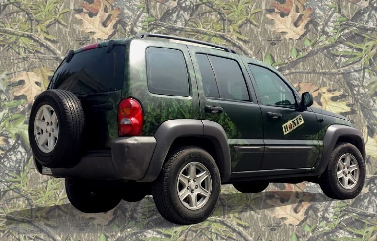 Image of a Jeep Liberty with a Camo Car Wrap.