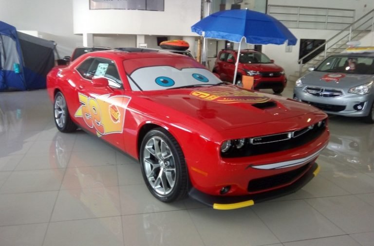 Sports Car Car Wrap with Cars' Movie design on dealer's sales floor.