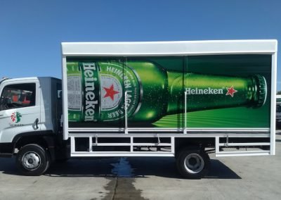 Mid-size truck with vibrant green Heineken printed vinyl Vehicle Wrap.