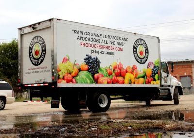 Truck Wrap of a 27' refrigerated delivery box truck with image of multiple fruits, logo, slogan and contact information.